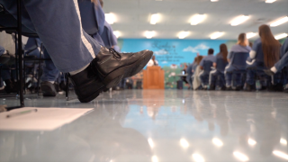 Female prisoners listen to a presentation on Human Trafficking